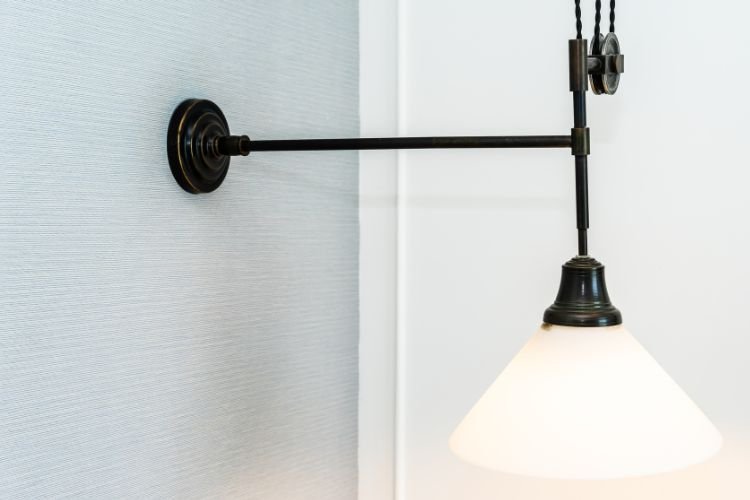 Maintaining Balance with Modern Black Wall Sconces Light in Living Room